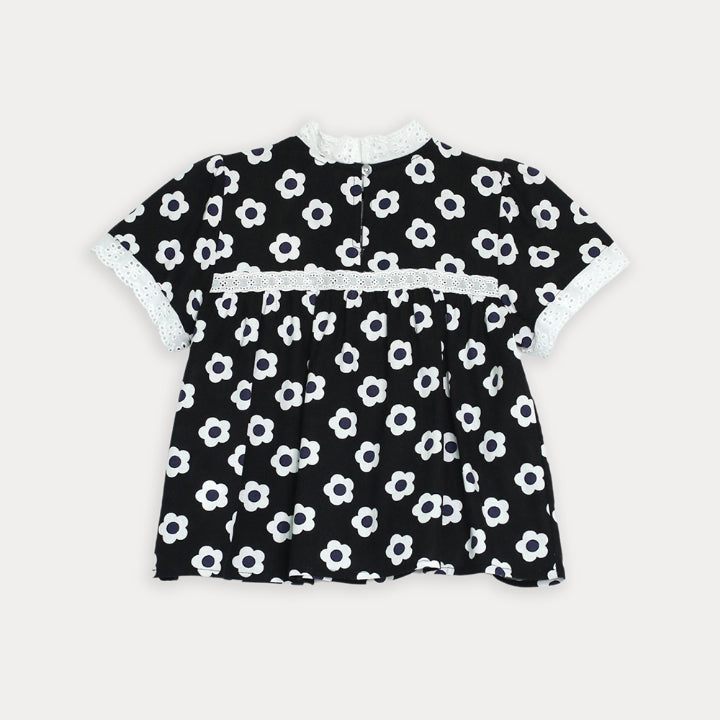 Blusa negra de flores para niña